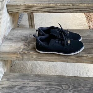 Black sneakers with embellished bottoms